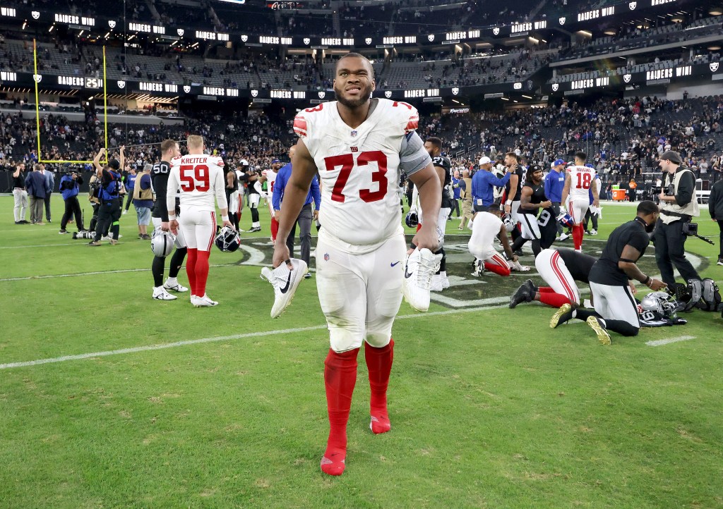 Evan Neal reacts as he walks off the field at the end of the fourth quarter after losing to the Raiders.