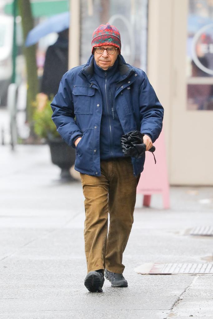 Rick Moranis walking on a rainy day in New York City on March 5, 2024.