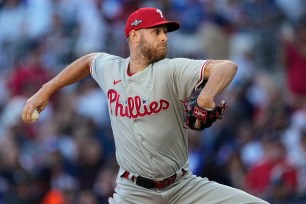 Zack Wheeler pitching in a baseball game for the Philadelphia Phillies during an NL Division Series game against the Atlanta Braves.