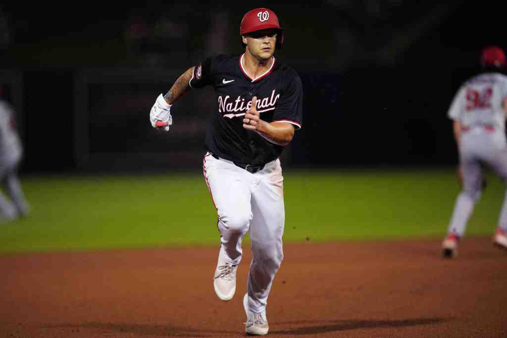 Washington Nationals third baseman Nick Senzel (13) running to third base during a spring training game against the St. Louis Cardinals in West Palm Beach, Florida.