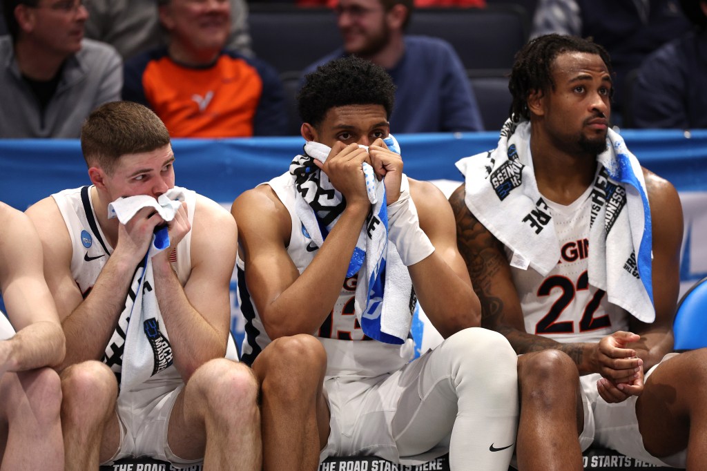 Virginia players react during their loss to Colorado State in the First Four on Tuesday.