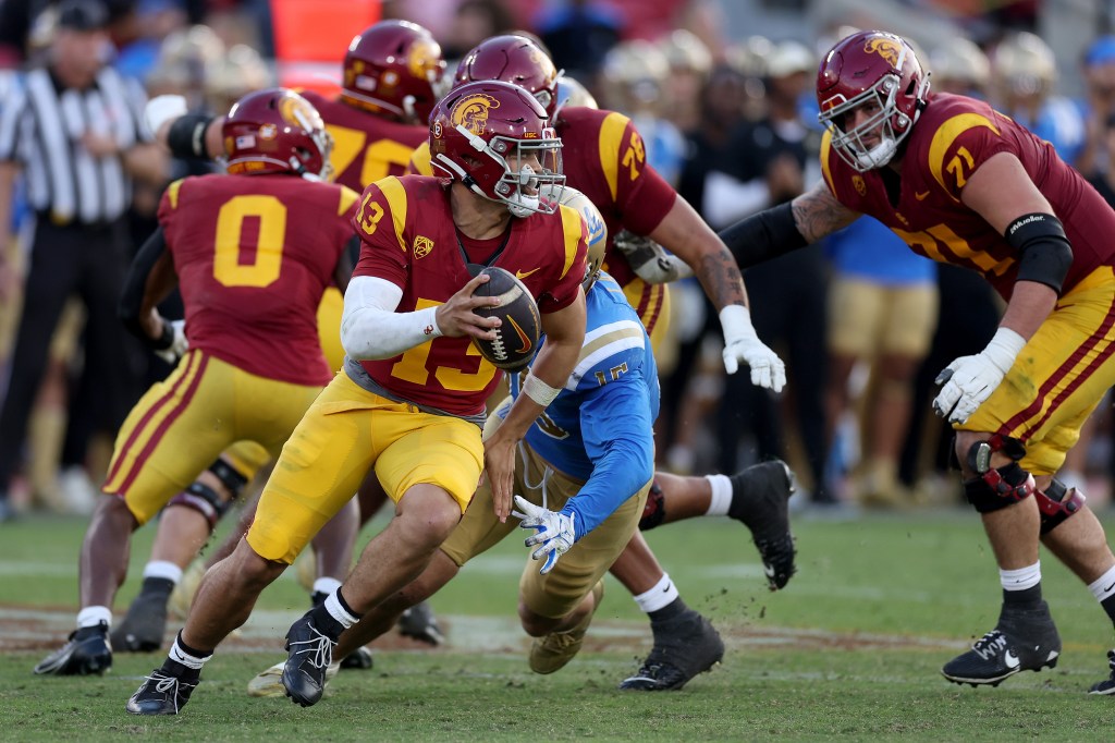 Caleb Williams #13 of the USC Trojans looks to pass during the first half of a game against the UCLA Bruins at United Airlines Field at the Los Angeles Memorial Coliseum on November 18, 2023 in Los Angeles, California.  