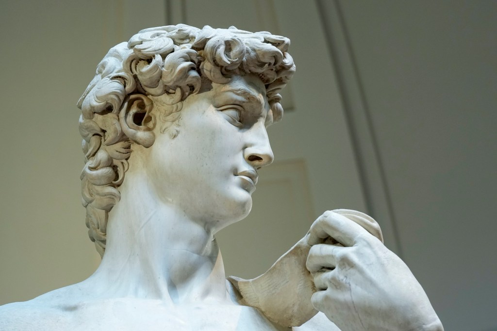 A detail of Michelangelo's 16th century statue of David is seen on display at the Accademia gallery, in Florence, central Italy, Monday, March 18, 2024.