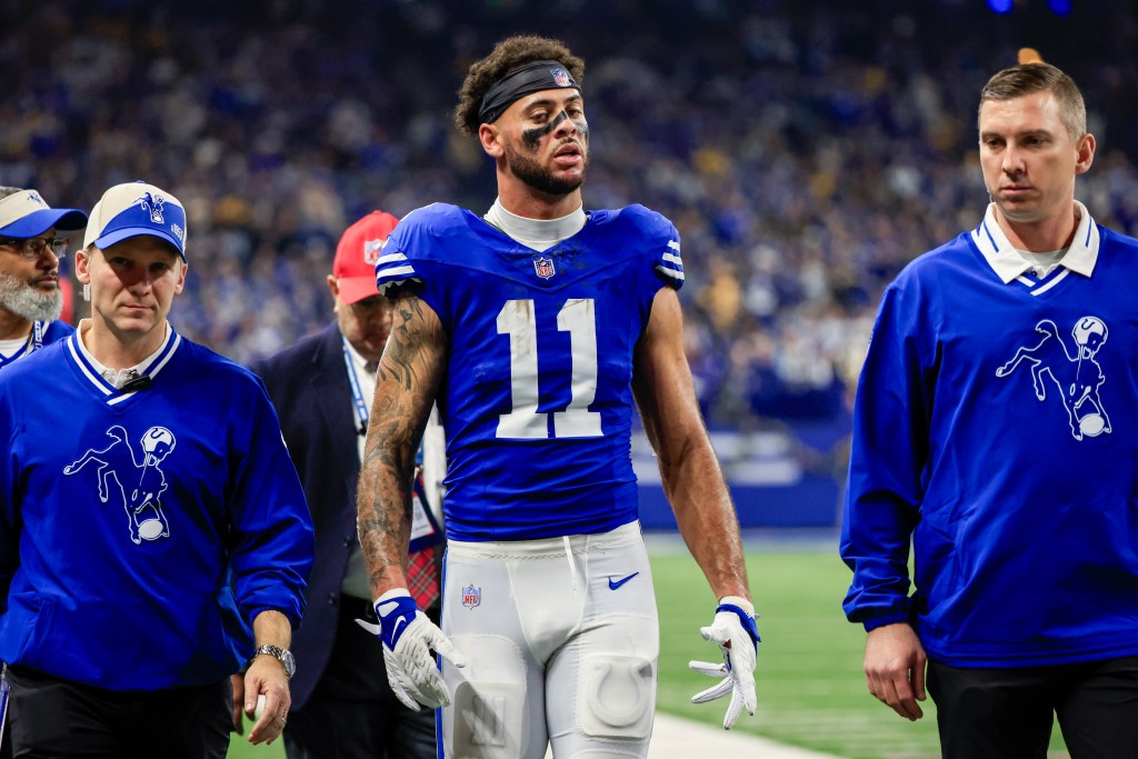 Michael Pittman Jr. #11 of the Indianapolis Colts is helped towards the locker room after being hit during the second quarter against the Pittsburgh Steelers at Lucas Oil Stadium on December 16, 2023 in Indianapolis, Indiana. 