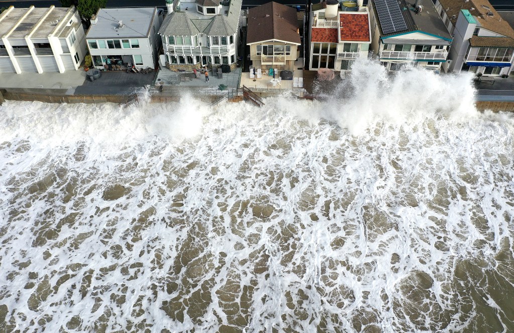 An aerial view of Pacific Ocean waves crashed against a seawall protecting homes near Ventura, Calif. 