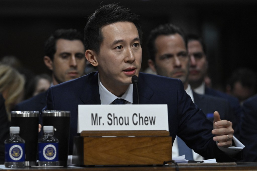 CEO of TikTok, Shou Zi Chew, testifying at a US Senate Judiciary Committee hearing in Washington DC. He is speaking into a microphone.