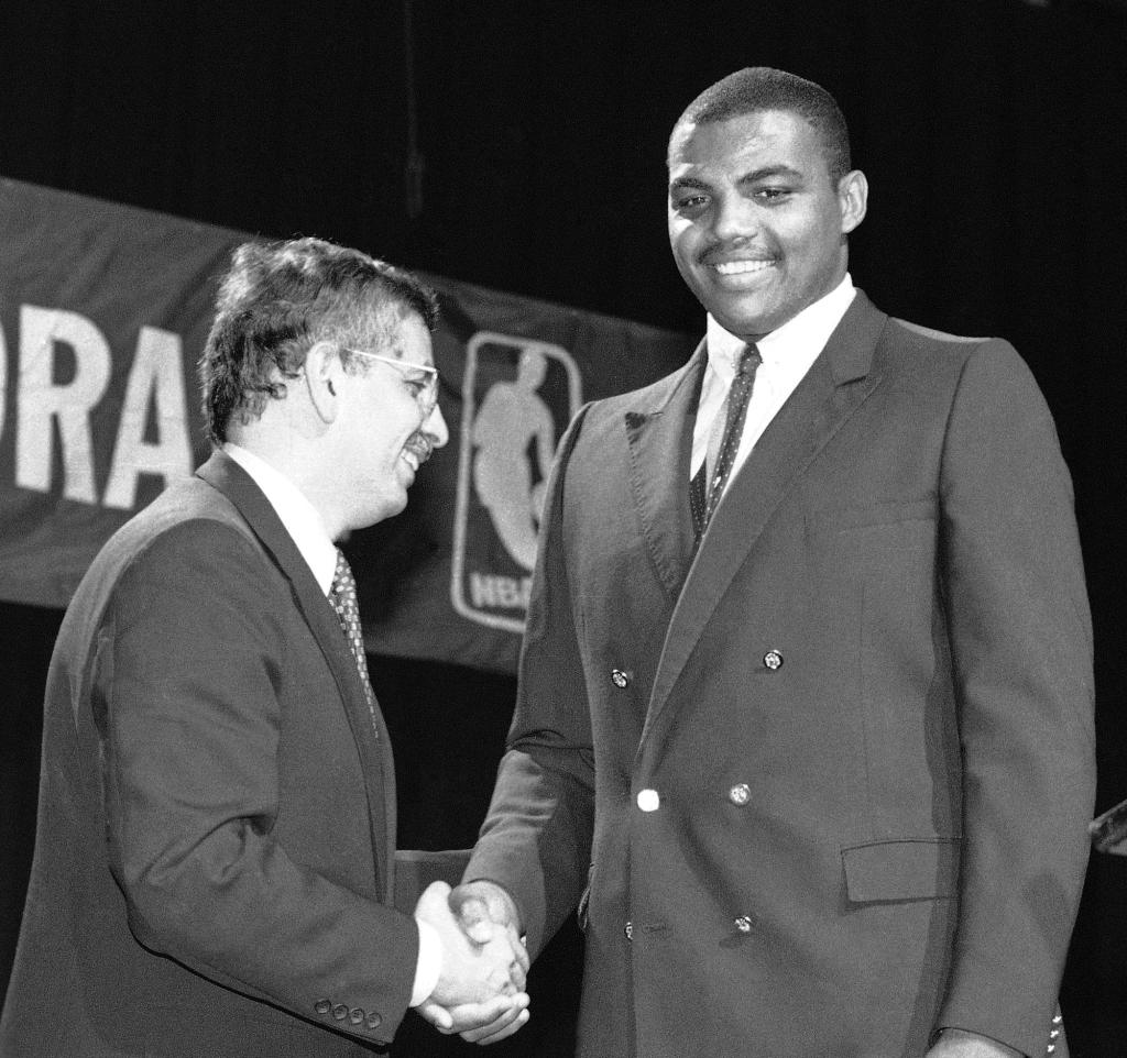 Late former NBA Commissioner David Stern, left, shakes Charles Barkley's hand in New York, after the former Auburn University forward was drafted by the Philadelphia 76ers. Barkley was picked fifth in the NBA draft. 