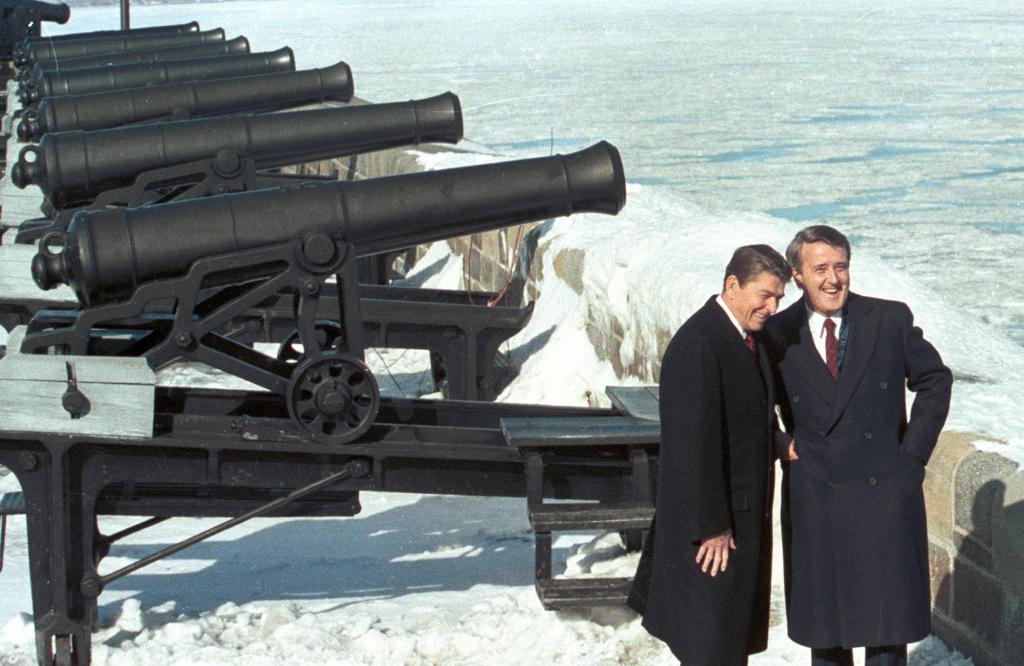 FILE PHOTO: Former U.S. President Ronald Reagan (L) stands with former Canadian Prime Minister Brian Mulroney