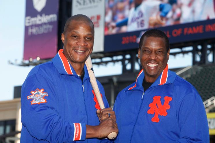 A photo of Darryl Strawberry and Dwight Gooden in Mets jackets sharing a smile.