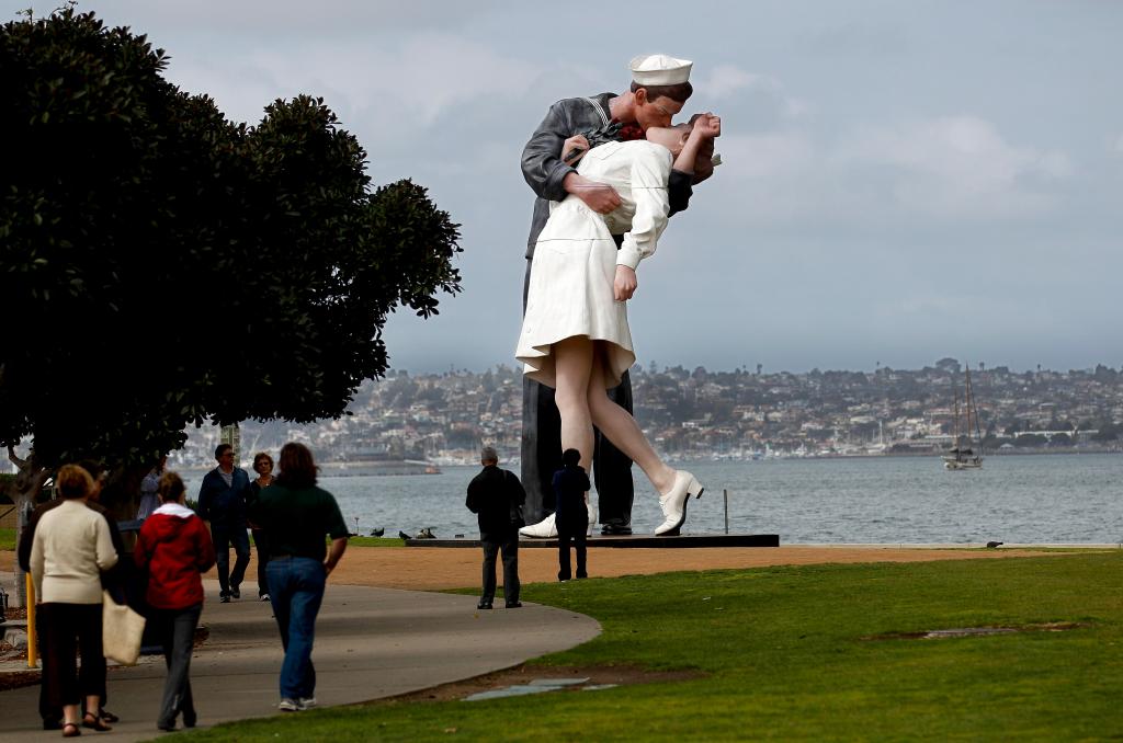 The statue entitled Unconditional Surrender stands tall in the parkway along the waterfront Monday, Feb. 13, 2012 in San Diego. The statue, which was modeled after a photograph by Alfred Eisenstaedt taken in Times Square on V-J Day at the end of World War II,  is schedule to be moved at the end of the month. (AP Photo/Lenny Ignelzi)