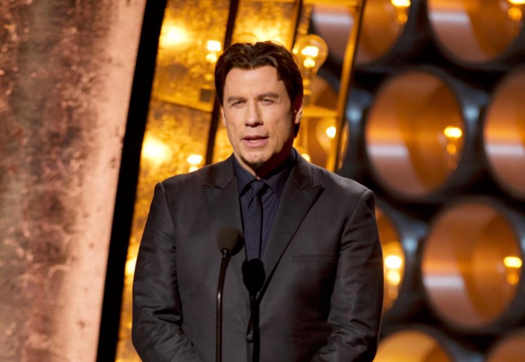 The "birth" of Menzel's alter ego came midway through the 2014 award show when Travolta, 70, attempted to introduce the "Rent" actress, who was performing the iconic power ballad "Let it Go" from the hit Disney film "Frozen." 