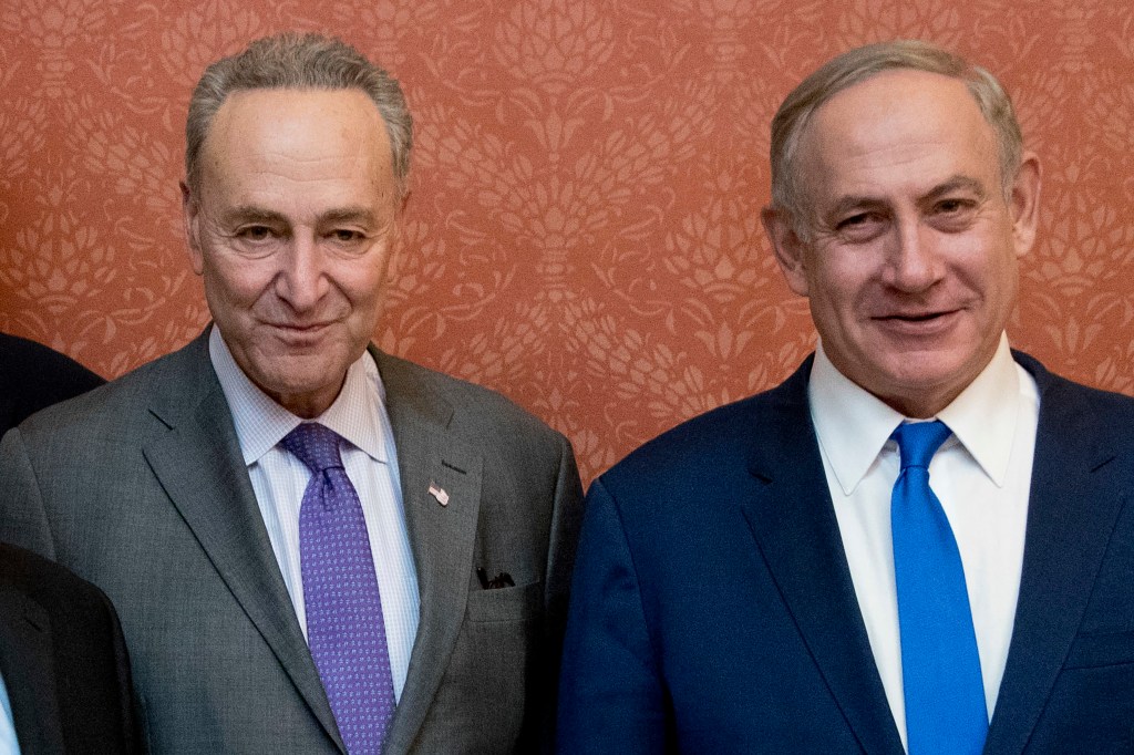 Israeli Prime Minister Benjamin Netanyahu, right, poses for a picture with Senate Minority Leader Chuck Schumer of New York, on Capitol Hill in Washington, Feb. 15, 2017. 