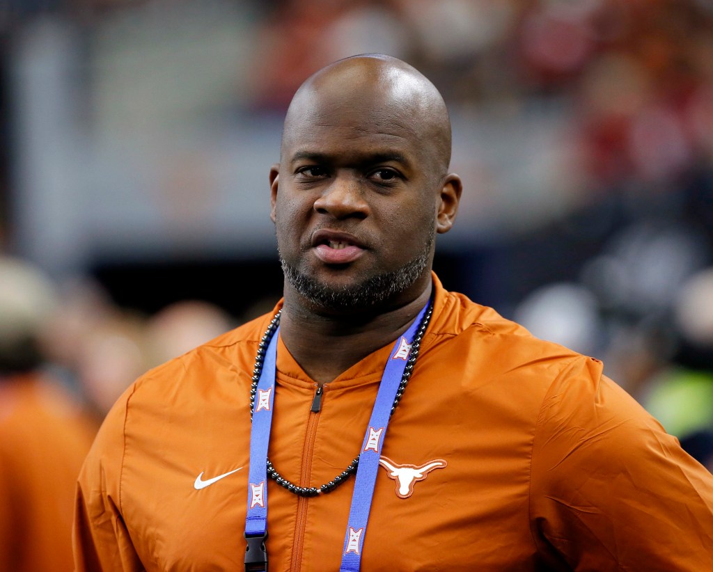 Former Texas NCAA college football quarterback Vince Young stands on the sideline during the first half of the NCAA Big 12 Conference championship against Oklahoma, in Arlington, Texas on  Dec. 1, 2018. 