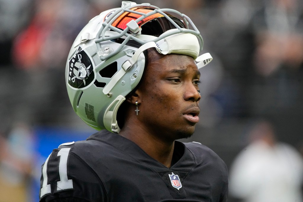 Raiders wide receiver Henry Ruggs III walks on the field before an NFL football game against the Chicago Bears, Oct. 10, 2021, in Las Vegas. 