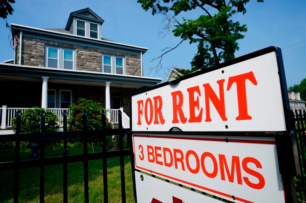 Sign indicating a home available for rent outside a building in Philadelphia, reflecting the rise in 'bleisure' travel due to remote working