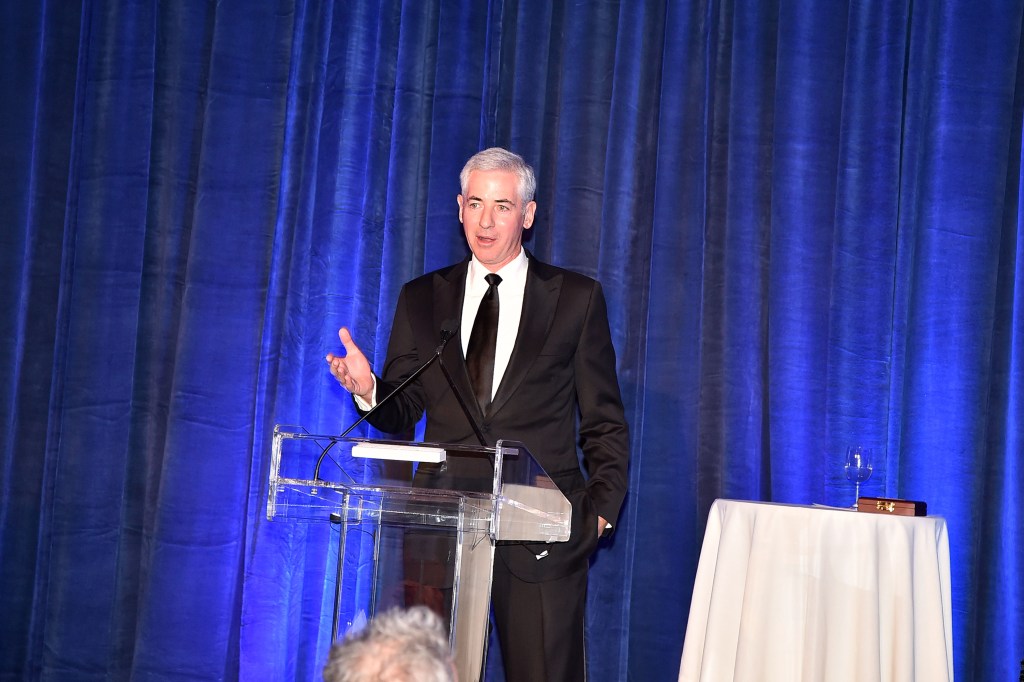 Bill Ackman speaking at a podium.