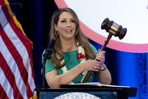 Republican National Committee Chair Ronna McDaniel holds a gavel while speaking at the committee's winter meeting in Dana Point, California.