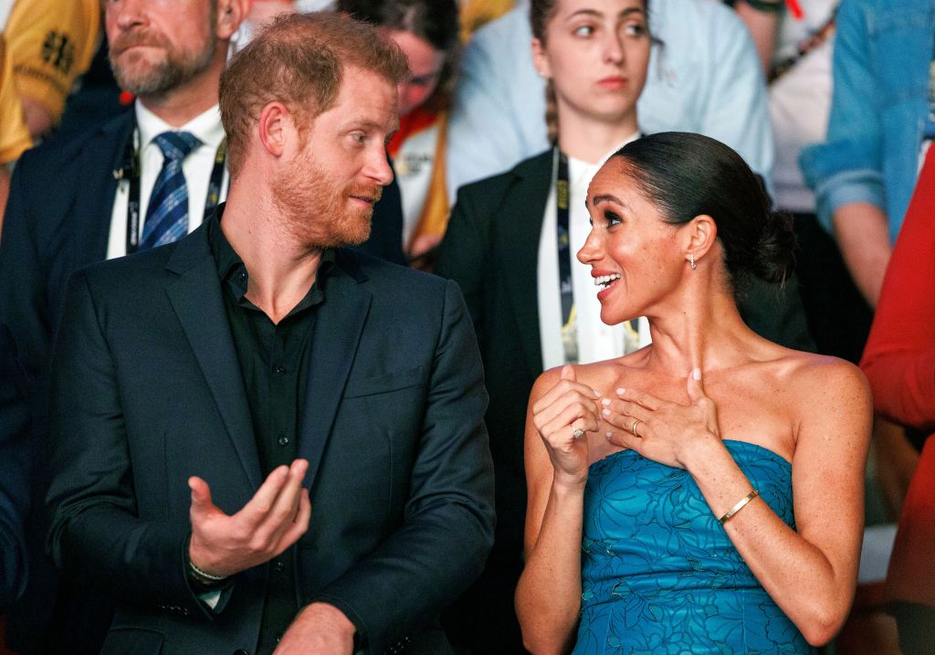 Prince Harry and Meghan Markle talking to each other
