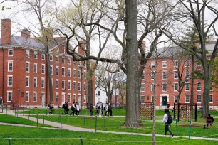 Students walking through Harvard Yard on the campus of Harvard University, Cambridge, Massachusetts