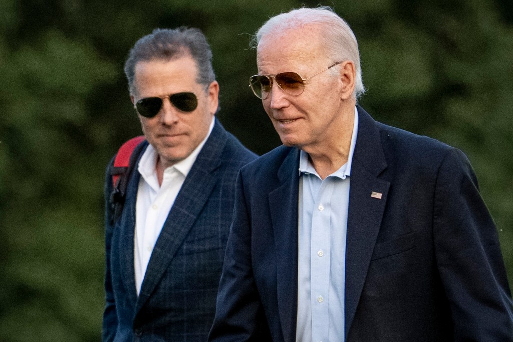 Joe and Hunter Biden arriving at Fort McNair in Washington, as seen from a distance.