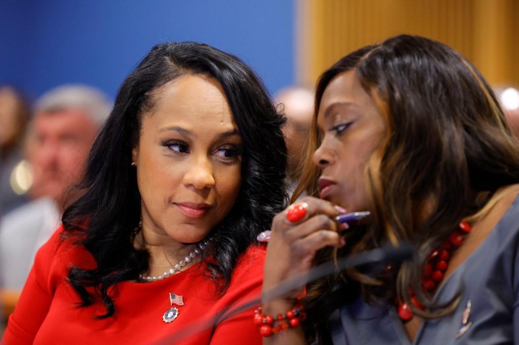 Fulton County District Attorney Fani Willis and prosecutor Daysha Young talking during a hearing at the Fulton County Courthouse in Atlanta, Georgia.