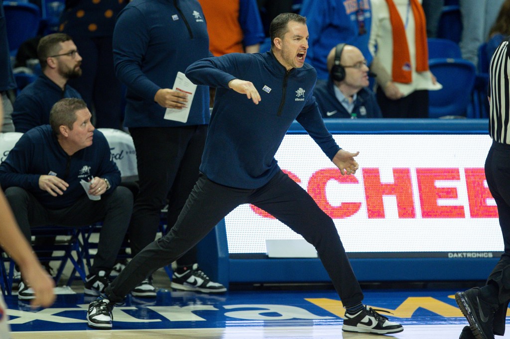 Utah State head coach Danny Sprinkle reacts to a call in overtime against Boise State. 