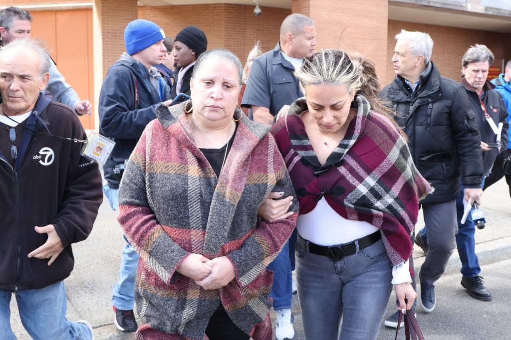 Family members of Malcolm Craig Brown leave a hearing for two of the four charged in the grisly find. 