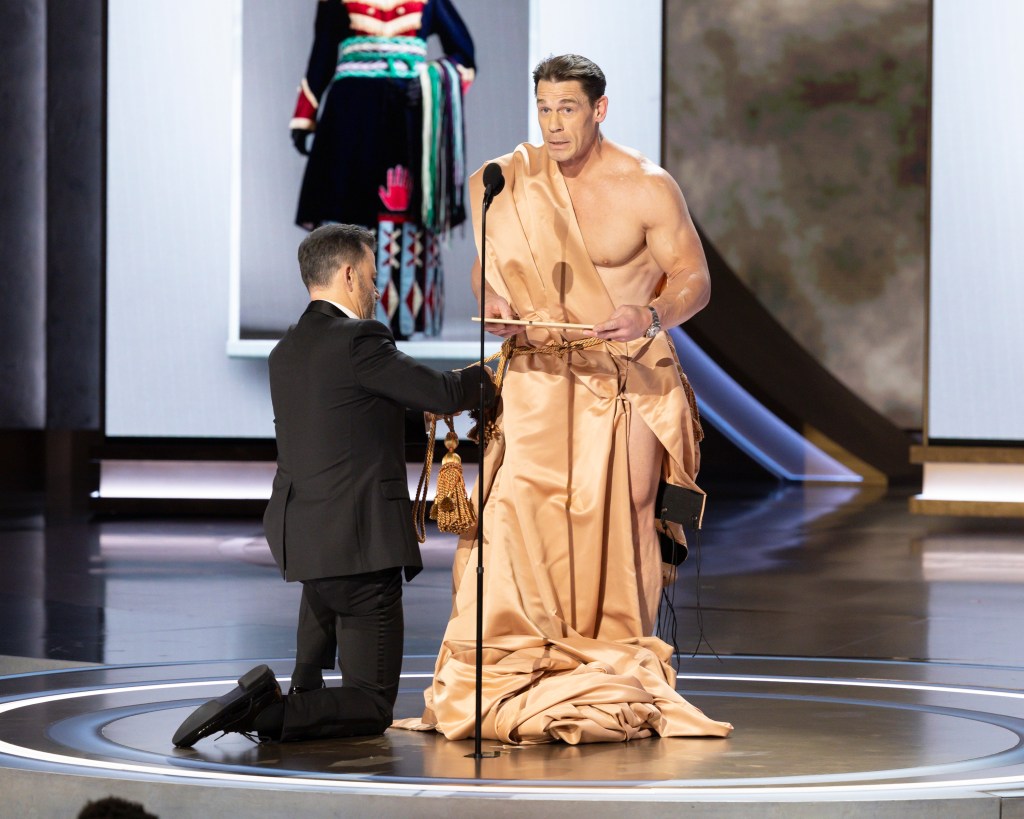 Jimmy Kimmel doing a comedy bit with John Cena at the 2024 Oscars.