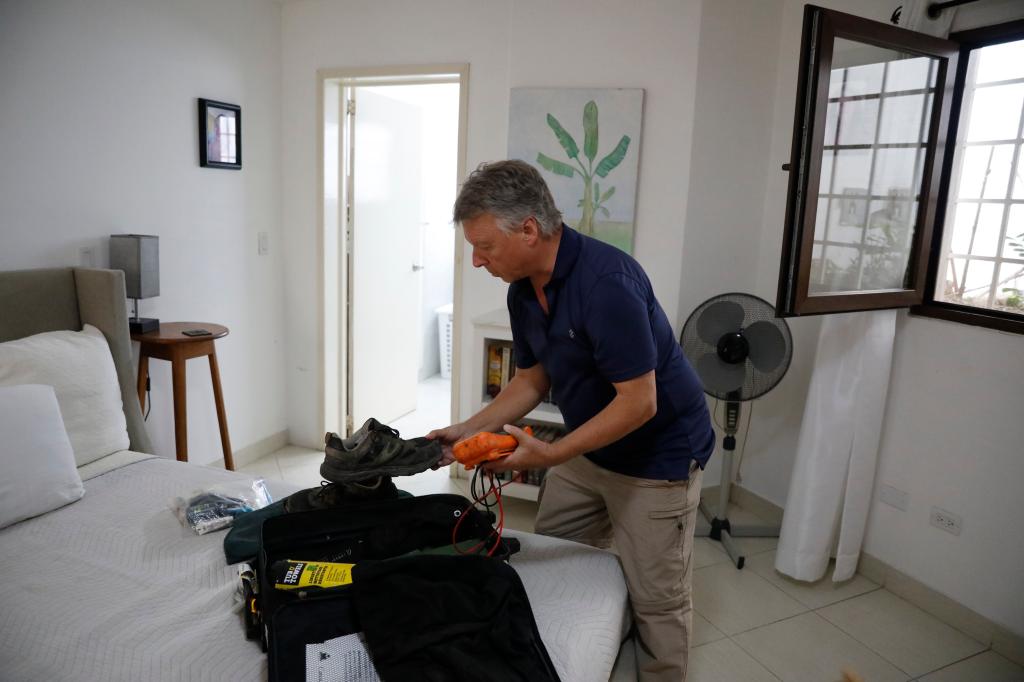 Canadian Richard Phillips packs his suitcase in Port-au-Prince, Haiti on March 8, 2024. 