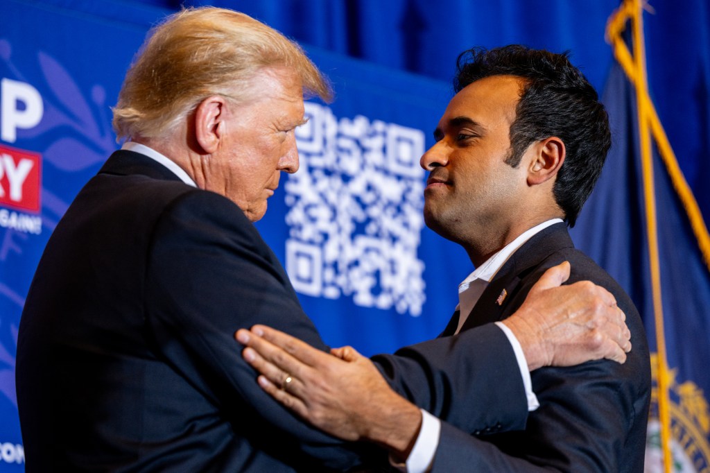 Trump and Vivek Ramaswamy embrace on stage at a rally in New Hampshire