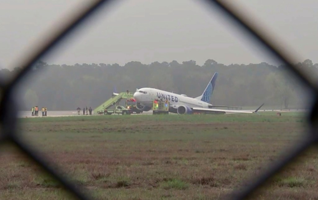 Passengers are evacuated from a United flight at George Bush International Airport, Friday, March 8, 2024 in Houston.