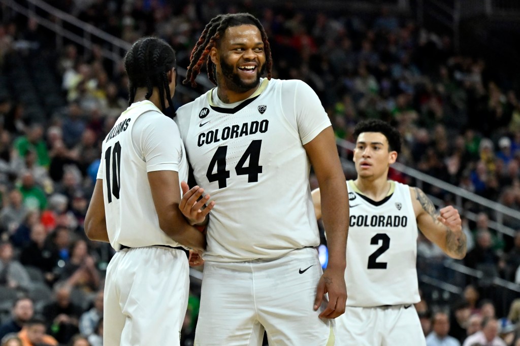 Eddie Lampkin Jr. #44 and KJ Simpson #2 of the Colorado Buffaloes.