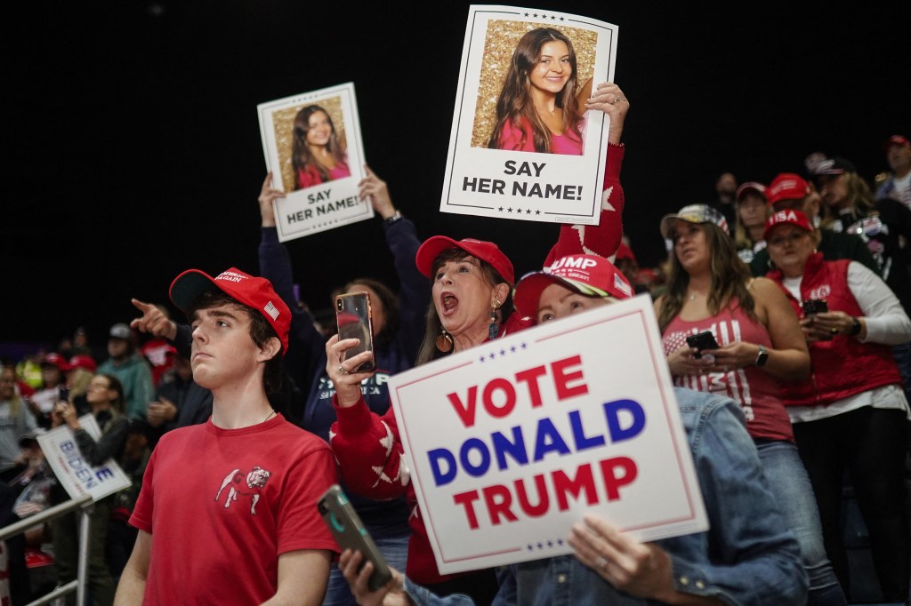 Supporters hold up signs at a "Get Out the Vote" rally in Georgia. (Photo by Elijah Nouvelage / AFP)