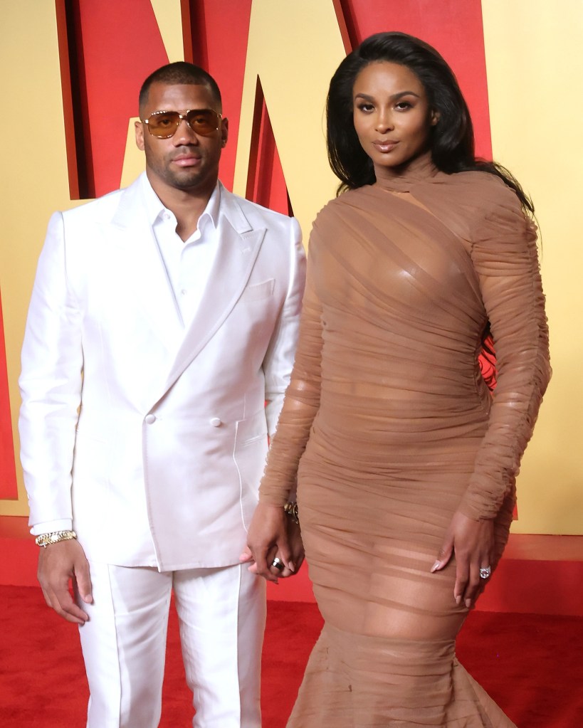 Ciara and Russell Wilson posing at Vanity Fair's Oscars party.