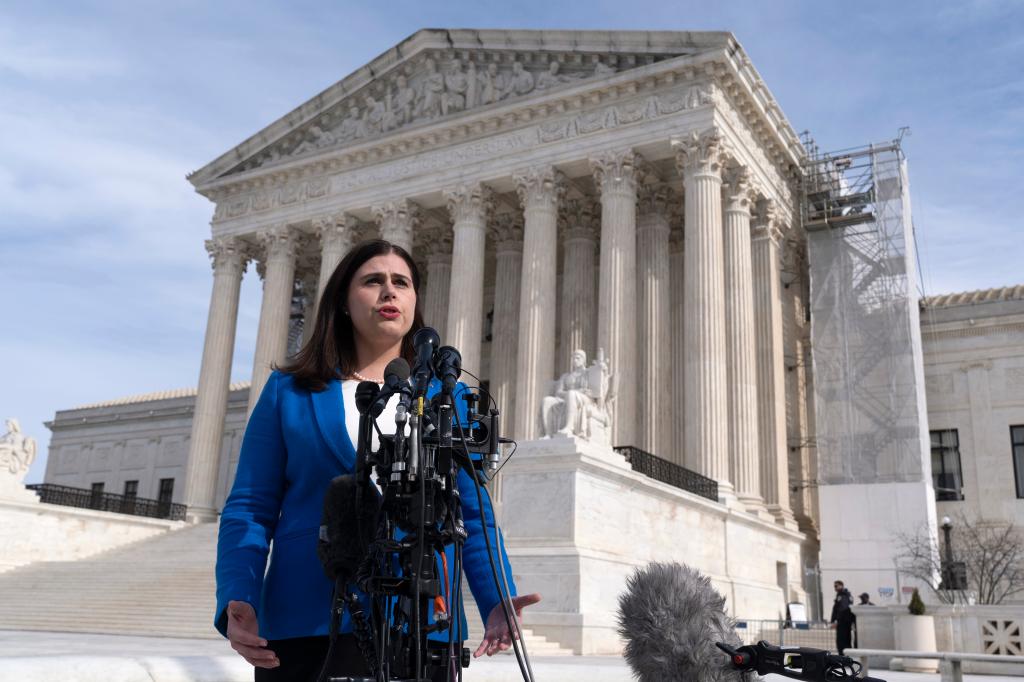 Colorado Secretary of State Jena Griswold speaks in front of the U.S. Supreme Court, Thursday, Feb. 8, 2024, in Washington.