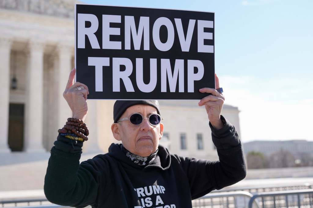 Activists held demonstrations outside the Supreme Court as they called on the judges to uphold Colorado's decision.