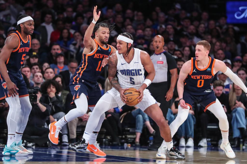 Orlando Magic forward Paolo Banchero (5) looks to drive past New York Knicks guard Jalen Brunson (11) in the fourth quarter at Madison Square Garden.