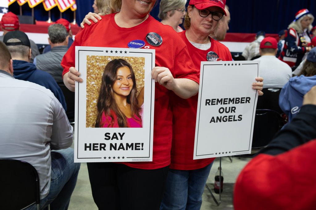 Trump supporters with posters showing murdered Georgia nursing student Laken Riley.