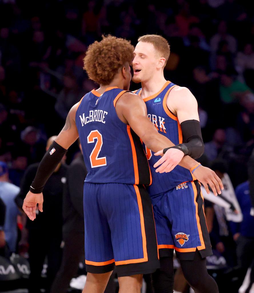 Donte DiVincenzo #0 of the New York Knicks is greeted by Miles McBride