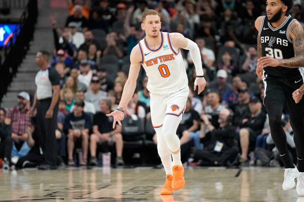 New York Knicks guard Donte DiVincenzo (0) reacts after scoring a three point basket during the first half against the San Antonio Spurs at Frost Bank Center.