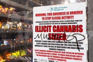 A sign from the state's Office of Cannabis Management outside an illegal pot shop in Manhattan.