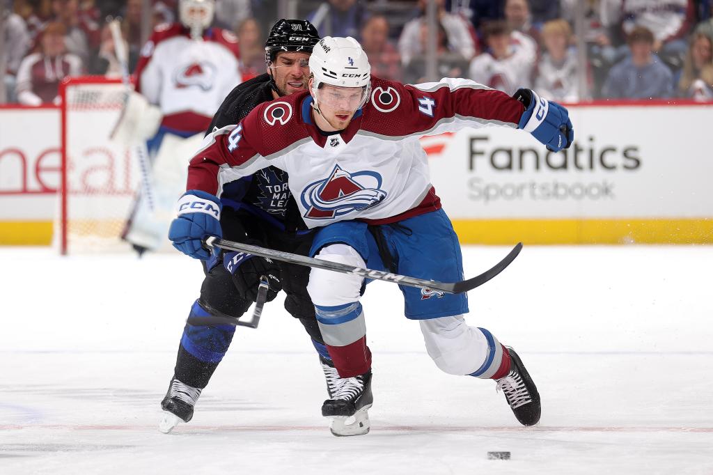 Bowen Byram #4 of the Colorado Avalanche skates against John Tavares #91 of the Toronto Maple Leafs at Ball Arena on February 24, 2024 in Denver, Colorado.