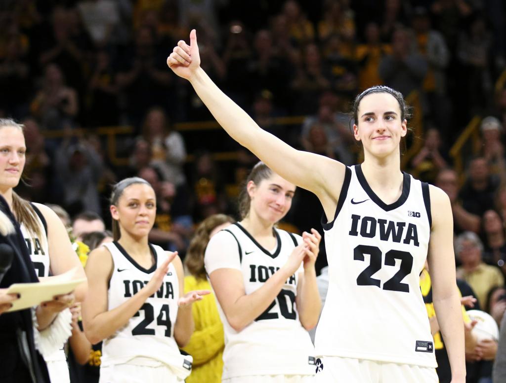 Guard Caitlin Clark #22 of the Iowa Hawkeyes waves to the crowd during senior day festivities