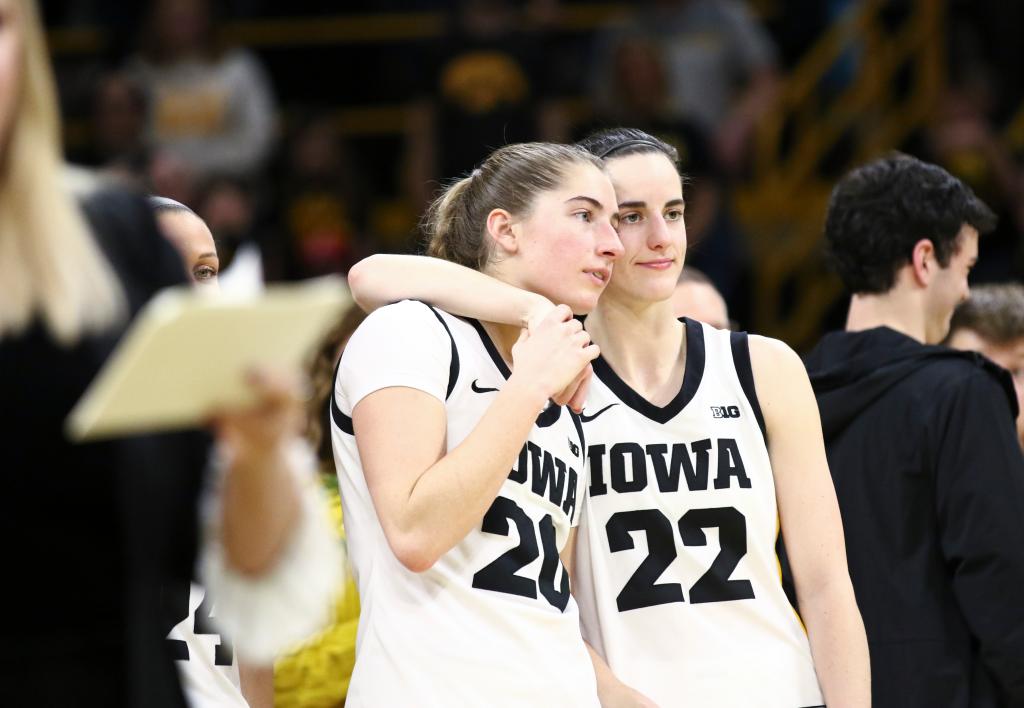 Guard Caitlin Clark #22 hugs guard Kate Martin #20  of the Iowa Hawkeyes during senior day festivities  after the match-up against the Ohio State Buckeyes at Carver-Hawkeye Arena on March 3, 2024 in Iowa City, Iowa. 