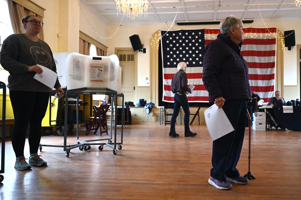 Voters wait to cast their ballots at the Old Stone School during the Super Tuesday primary in Hillsboro, Virginia on March 5, 2024.