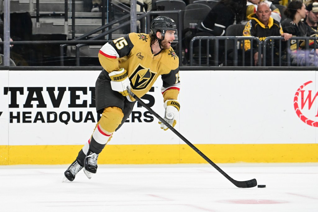 Noah Hanifin #15 of the Vegas Golden Knights skates the puck up ice against the Vancouver Canucks