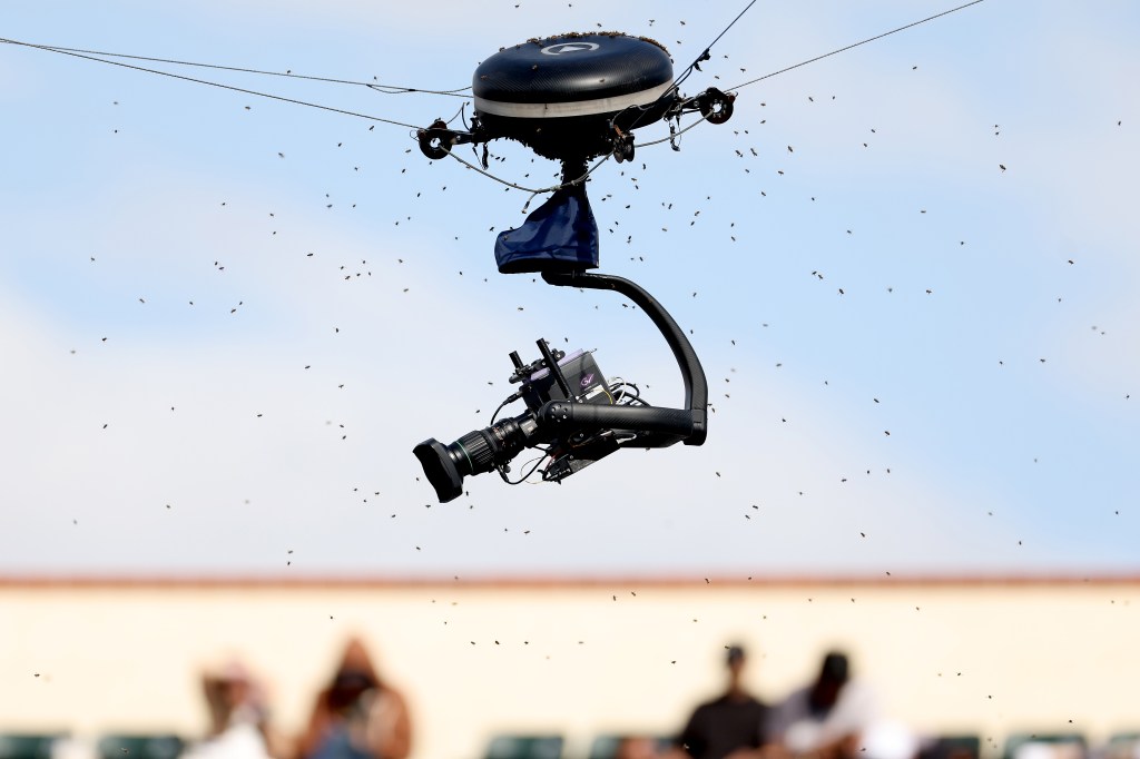 An invasion of bees suspends play between Carlos Alcaraz of Spain and Alexander Zverev of Germany during the BNP Paribas Open at Indian Wells Tennis Garden on March 14, 2024