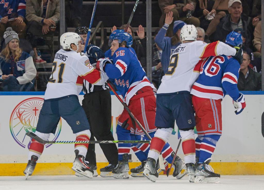 A scuffle breaks out between Nick Cousins #21 of the Florida Panthers and Ryan Lindgren #55 of the New York Rangers