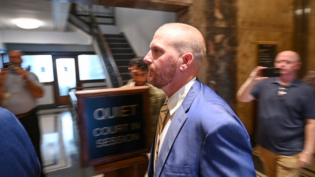 Former Kansas City Chiefs assistant coach Britt Reid walks to a courtroom at the Jackson County Courthouse on Sept. 12, 2022, in Kansas City, Mo.