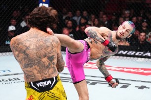 Sean O'Malley kicks Marlon Vera during their the UFC bantamweight championship fight during the UFC 299 event at Kaseya Center on Saturday in Miami.